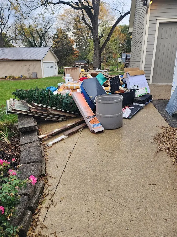 Dumpster being loaded with debris for Commercial Dumpster Rental in Shapleigh